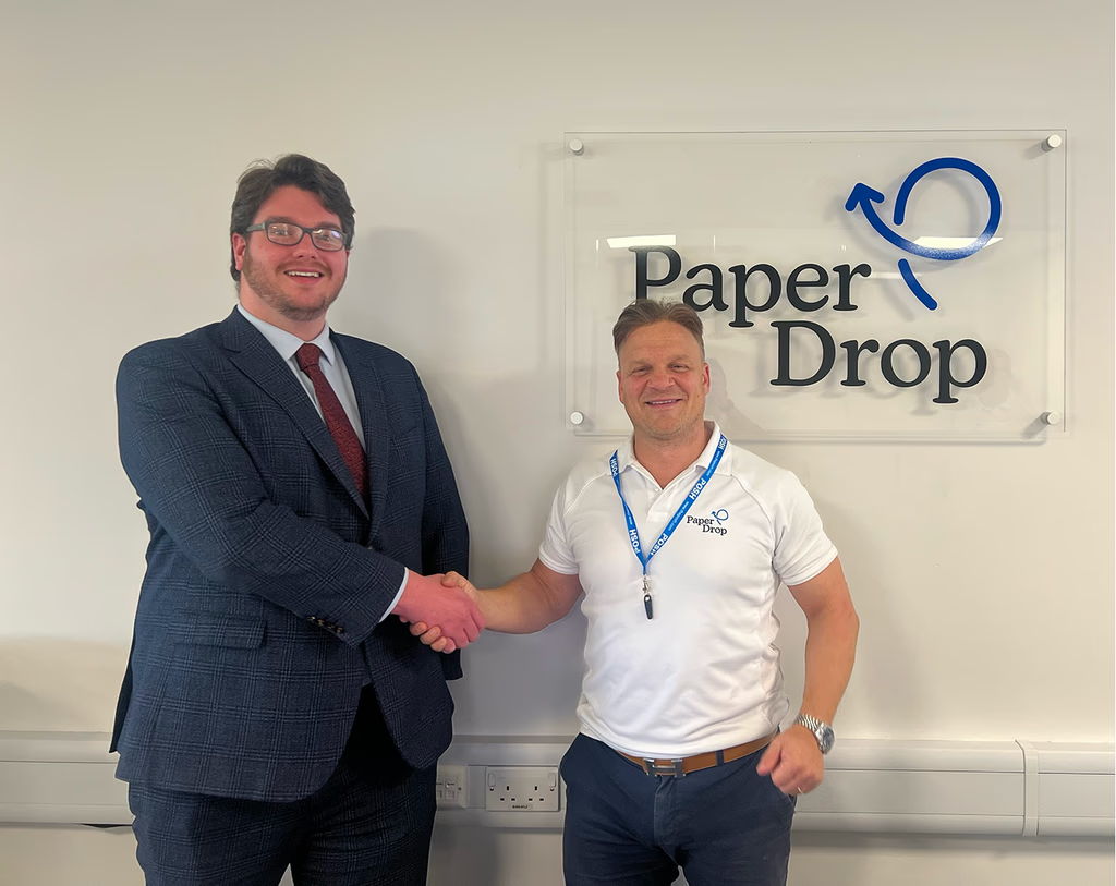 PaperDrop team members in business meeting